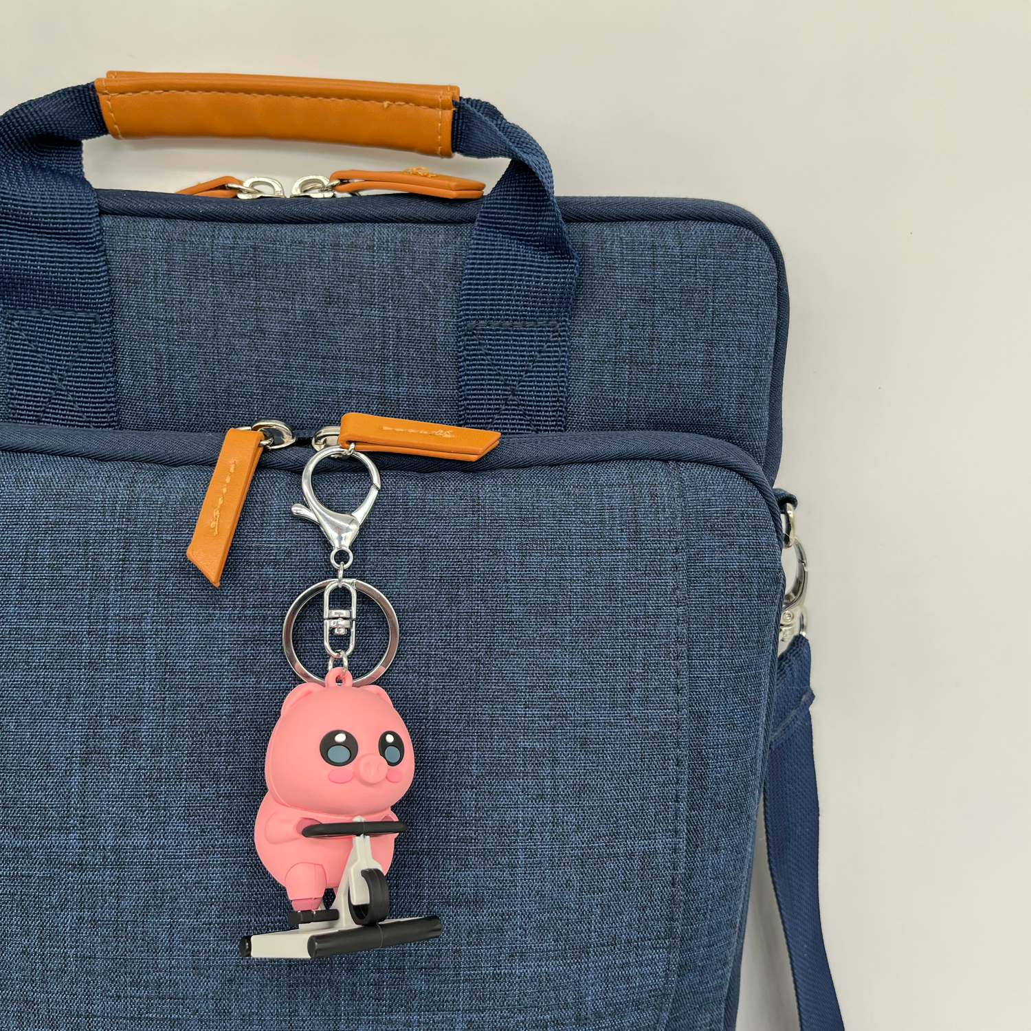 Pig on a Bike Keychain